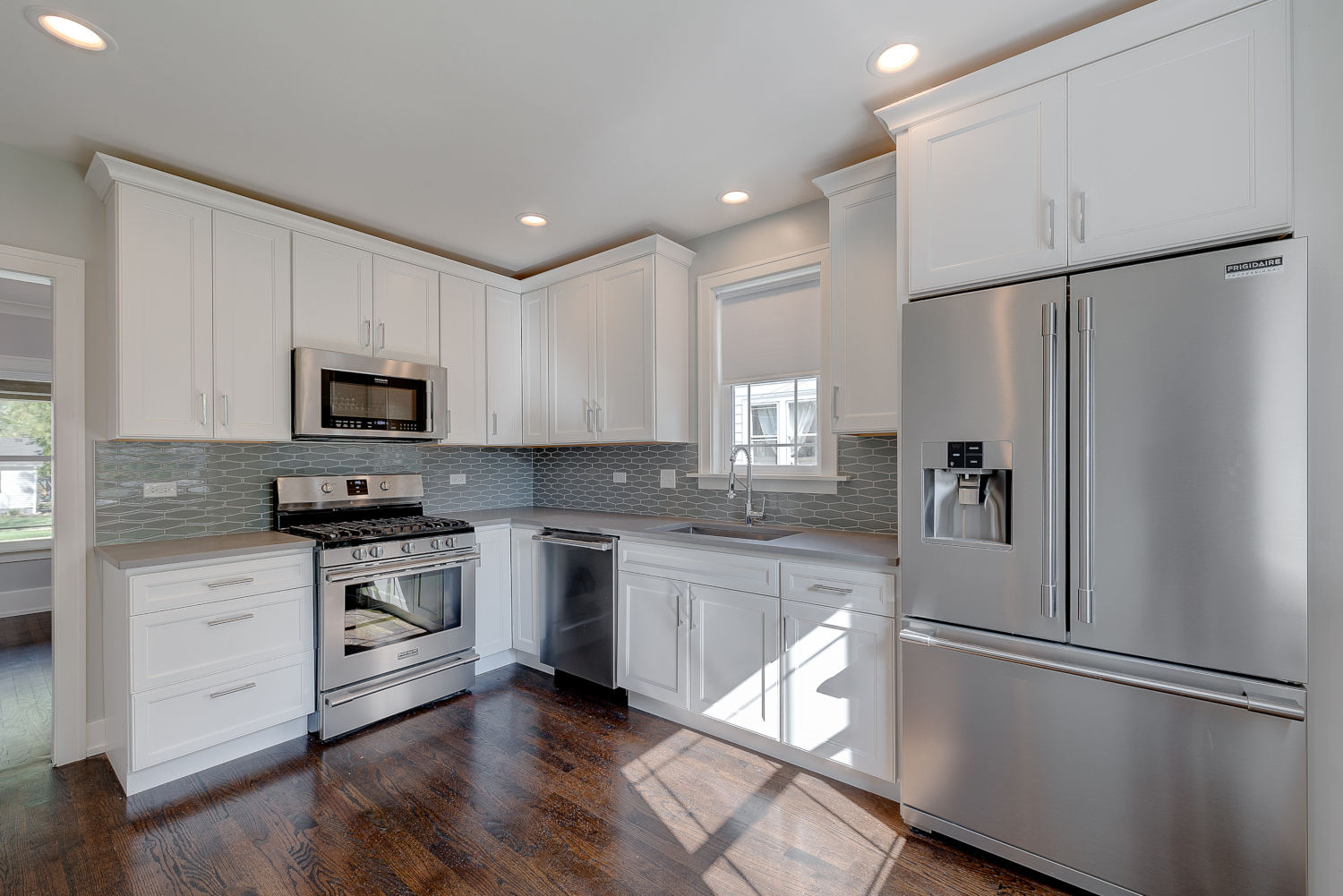 Kitchen renovation kitchen design - view of range and sink - Platinum Builders