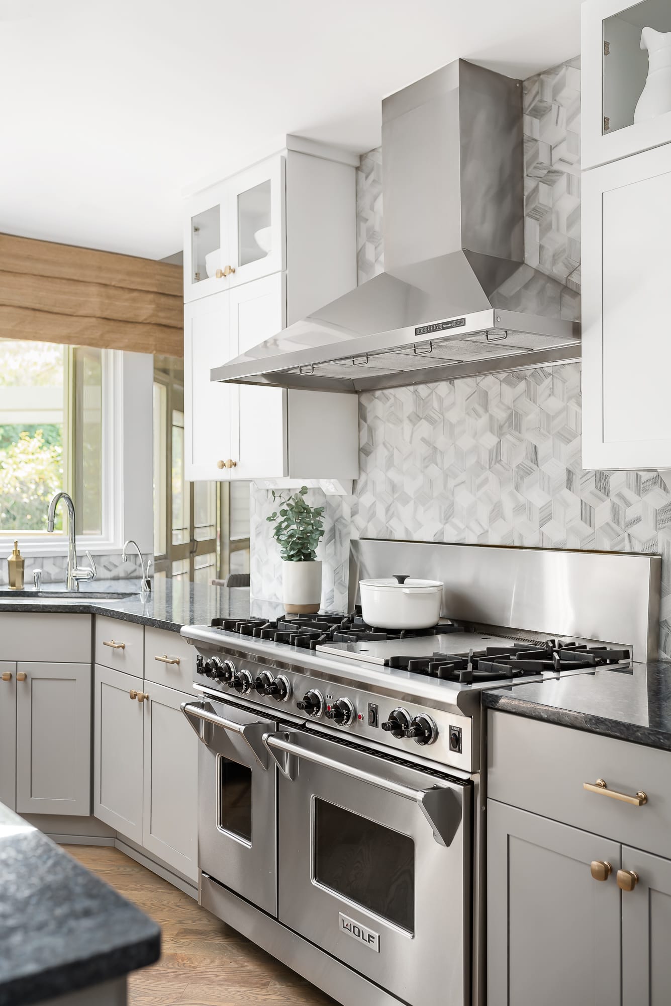 Kitchen remodel in Downers Grove - closeup of large stainless steel range and exhaust hood.