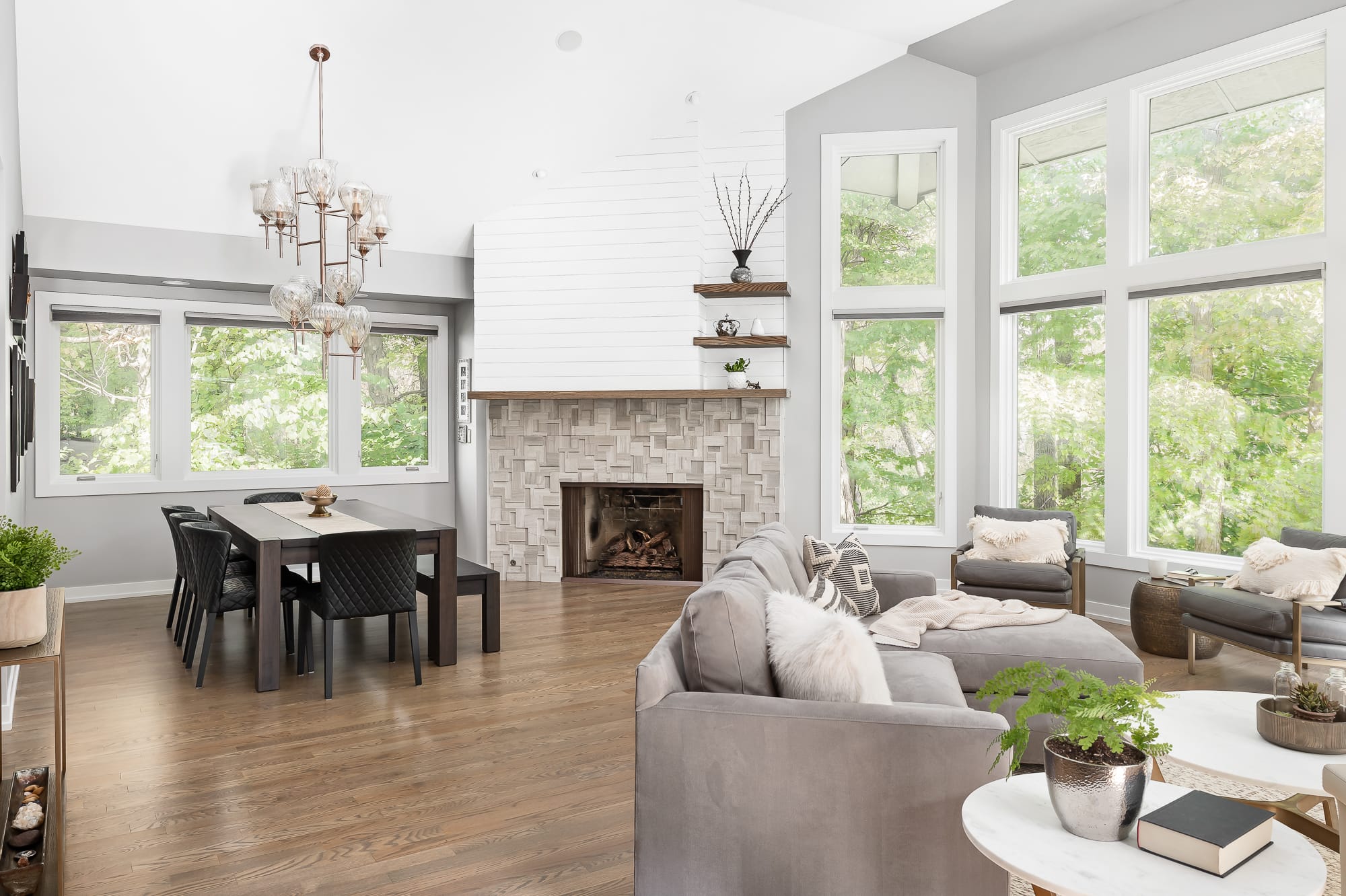 Living Room remodel in Downers Grove - wide view of dining table, fireplace and sitting area.