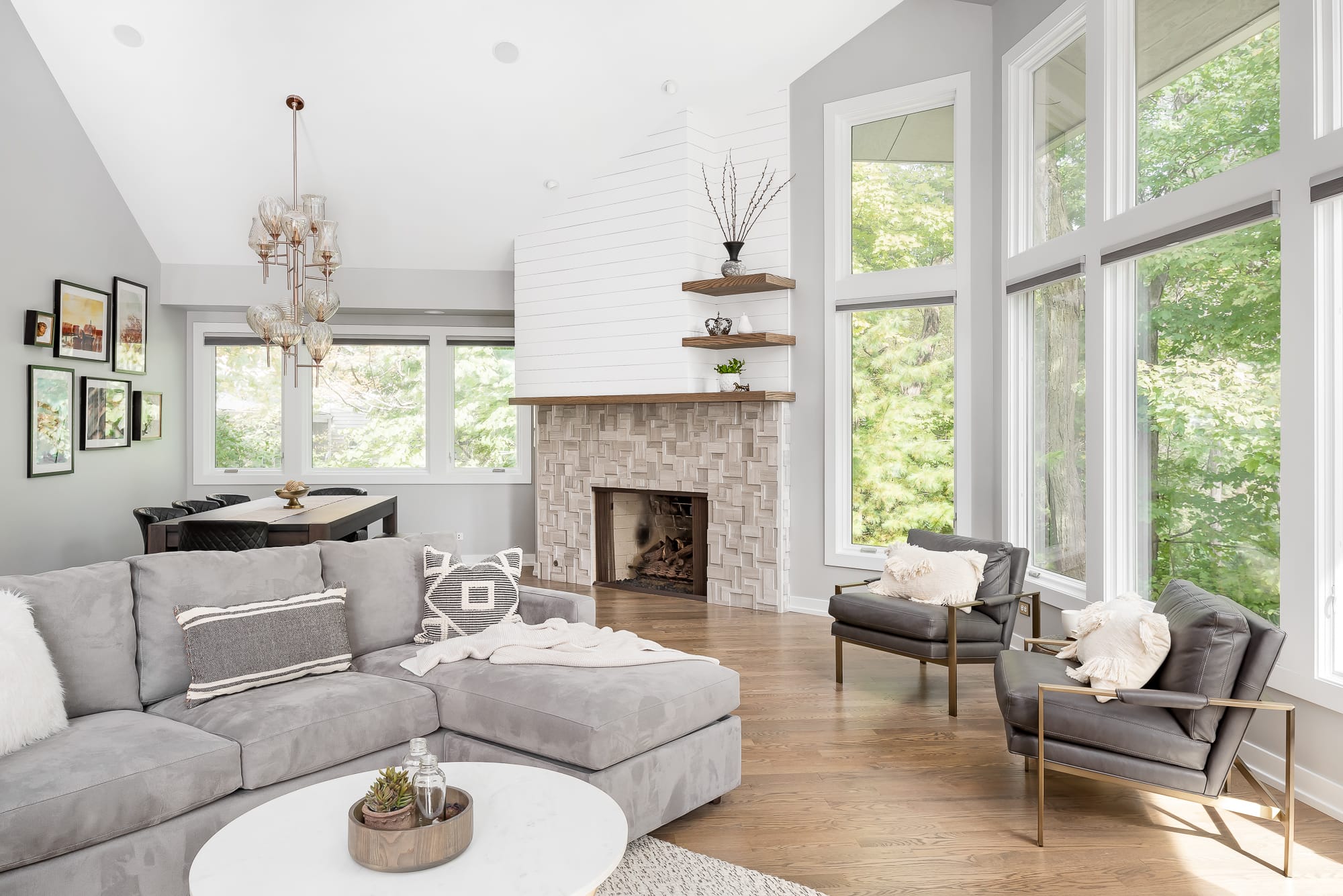 Living Room remodel in Downers Grove - view of large Living Room windows, fireplace and dining table.