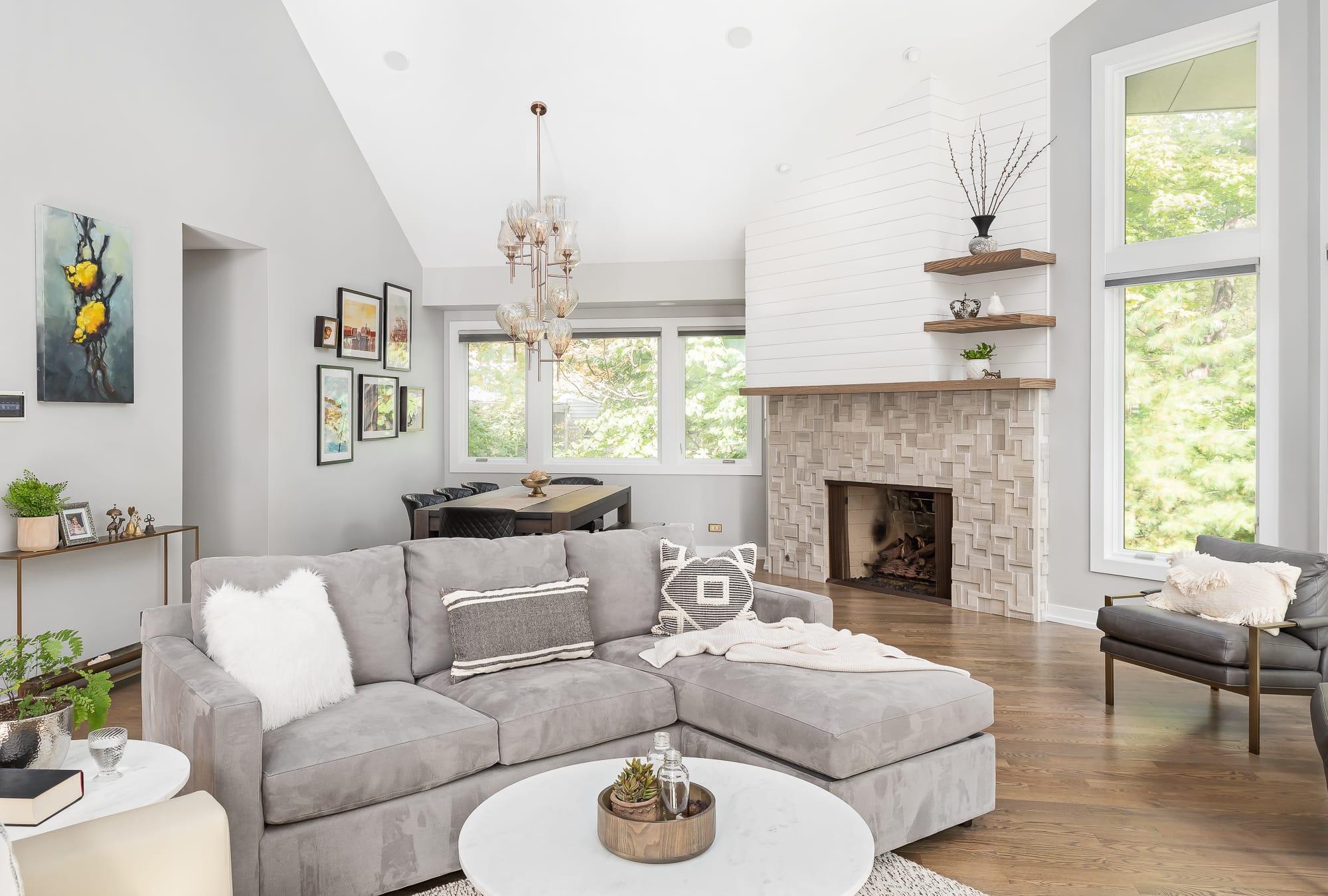 Living Room remodel in Downers Grove - view of couch, fireplace and dining table.