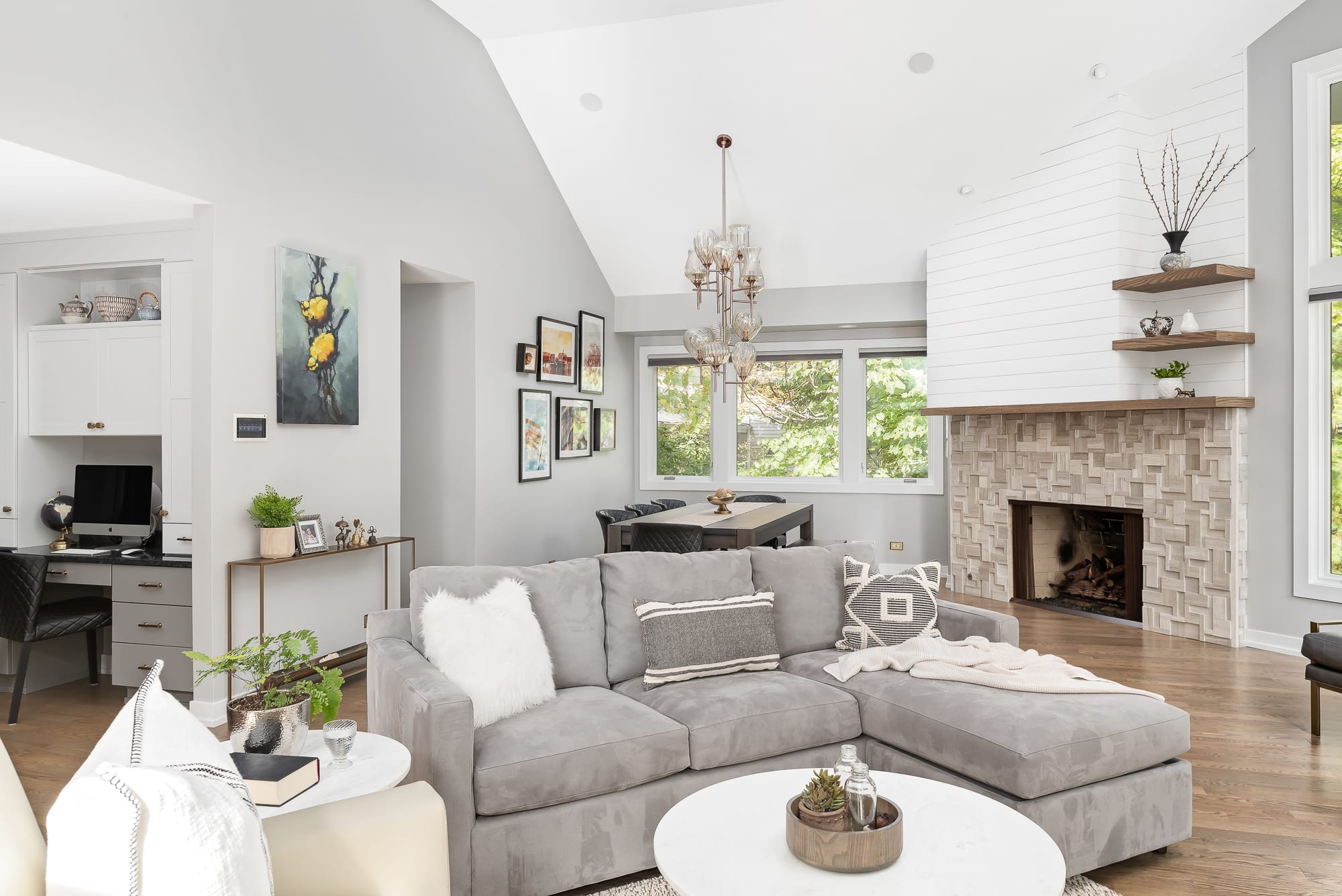 Living Room remodel in Downers Grove - view of couch, fireplace and dining table.