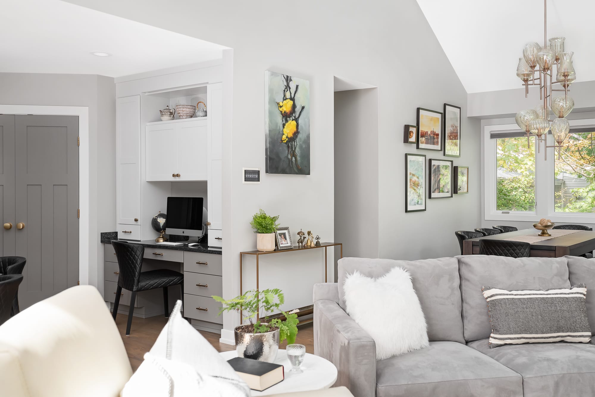 Living Room remodel in Downers Grove - view of dining table, picture wall and kitchen office nook.