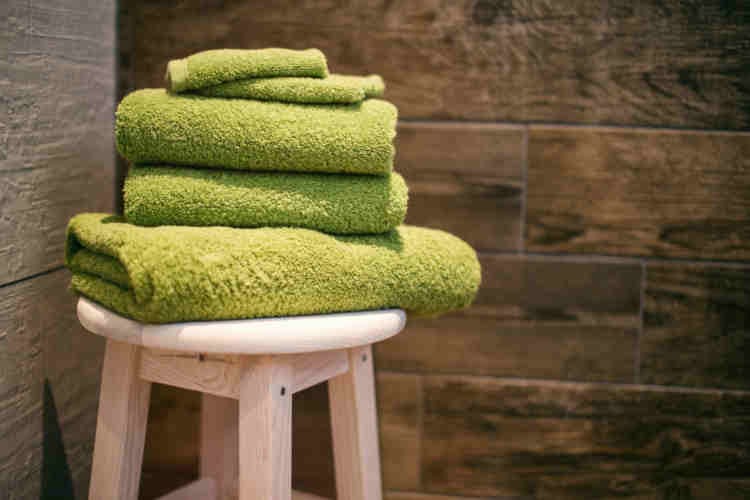 Bathroom towels on a stool